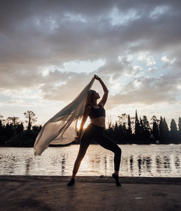 Woman in a calm yoga pose, embodying balance and fluidity.